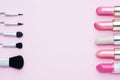 Set of colored pink lipsticks and blush on pink background. Women`s cosmetics. Selective focus. Copy space Royalty Free Stock Photo