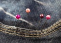 Set of colored pins in denim Royalty Free Stock Photo