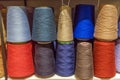 Set of colored threads for sewing on coils. Pile of big colorful spools of thread. Colored thread spools of thread large class, Royalty Free Stock Photo