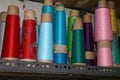 Set of colored threads for sewing on coils. Pile of big colorful spools of thread. Colored thread spools of thread large Royalty Free Stock Photo
