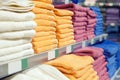 A set of colored towels on a shelf in a store. Royalty Free Stock Photo