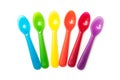 Colorful baby plastic spoons on white background Royalty Free Stock Photo