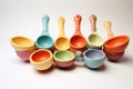 set of colorful baby spoons and bowls