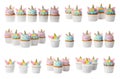 Set of colorful birthday unicorn cupcakes on white background Royalty Free Stock Photo