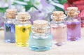 Set of colorful bottles with floral essential oil