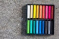 Set Of Colorful Chalk Stick On Black Tray Background