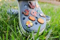 Set of colorful Crocs shoe decorations. Close-up of Jibbitz inserts Royalty Free Stock Photo
