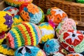 Set of colorful handmade Easter eggs in a basket, group of handcrafted traditional Polish pisanki, group of objects detail