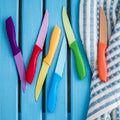 Set of Colorful Kitchen Knives on a Napkin Royalty Free Stock Photo