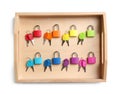 Set of colorful locks and matching keys in box isolated on white, top view. Montessori toy Royalty Free Stock Photo