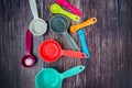Colorful measuring cups, measuring spoons and whisk use in cooking lay on tabletop Royalty Free Stock Photo