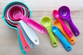 Set of colorful measuring cups and measuring spoons use in cooking. Royalty Free Stock Photo