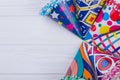 Set of colorful party hats on wooden table.