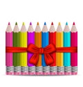 Set colorful pencils decorated by bow on white bac Royalty Free Stock Photo