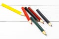 Set of colorful pencils on a white table background. View from above. Royalty Free Stock Photo