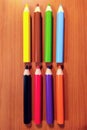Set of colorful pencils on wooden background Royalty Free Stock Photo