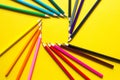 Set of colorful pencils on a yellow background is laid out in a circle in the shape of the square. Copyspace, frame. Back to Royalty Free Stock Photo