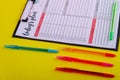 Set colorful pens and week calendar close-up.