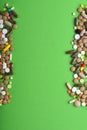Set of colorful pills scattered on green background Royalty Free Stock Photo