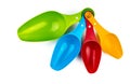 Set of colorful plastic measuring spoon isolated on white background with shadow. Green, blue, red, and orange measuring spoon Royalty Free Stock Photo