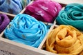 Set of colorful scarfs in wooden box Royalty Free Stock Photo