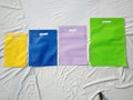 Set of colorful shopping bags on white background. Amazing color eco bags. Non woven fabric bag
