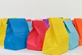 Set of colorful shopping folded paper bags. Paper shopping bags mockup.