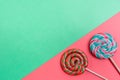 Set of colorful spiral lollipops on colored paper