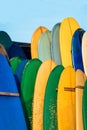 Set of colorful surfboard for rent on the beach. Multicolored surf boards different sizes and colors surfing boards on Royalty Free Stock Photo