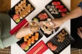 A set of colorful sushi set on a white table with wine in a cozy room Royalty Free Stock Photo