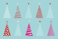 Set of colorful vector stylized Christmas tree, logo icon festive isolated on blue background Royalty Free Stock Photo