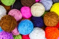 Set of colorful wool yarn balls. Hanks are set out in a pile. Wool yarn rolls. Colorful threads for needlework. Colorful