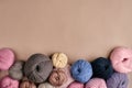 Set of colorful wool yarn on beige background. Top view Royalty Free Stock Photo