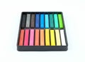 Set of colourful chalk pastel in a box on white background