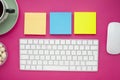Set of colourful stickers, white keyboard, notebook and snacks.