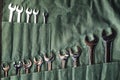 Set of combination wrenches on green fabric for repairing and fixed Royalty Free Stock Photo