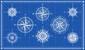 Set of compass roses or wind roses on blueprint background Royalty Free Stock Photo