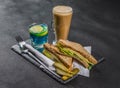 set consisting of two sandwiches malted bread with vintage cheddar cheese, pickles, red onion, tomato, lettuce, blue drink and co Royalty Free Stock Photo