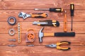 Set of construction tools on a brown wooden background. Hammer, wrench, pliers and screwdriver. Gift card for the holiday Labour Royalty Free Stock Photo