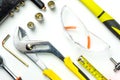 Set of construction tools on white background as wrench, hammer, pliers, socket wrench, spanner, tape measure, electric