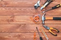 Set of construction tools on a wooden background. Hammer, wrench, pliers and screwdriver. Frame for the holiday Labor Day, Father Royalty Free Stock Photo