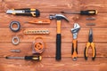 Set of construction tools on a wooden background. Hammer, wrench, pliers and screwdriver. Gift card for the holiday Labor Day, Royalty Free Stock Photo