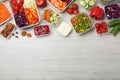 Set of containers with fresh food on white wooden table, flat lay. Space for text Royalty Free Stock Photo