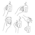 Set continuous line drawing of hands holding a cups of tea or coffee Royalty Free Stock Photo