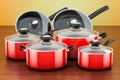 Set of cooking red kitchen utensils and cookware. Pots and pans