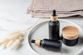 Set of cosmetic products on a marble table of the bathroom. Cosmetic package collection for cream and face serum. Natural beauty Royalty Free Stock Photo