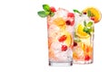 Set of crafted cocktails with berries, a slice of orange, ice cubes and a sprig of mint Royalty Free Stock Photo