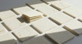 A set of cream-colored square paper coasters arranged neatly on a surface, Royalty Free Stock Photo