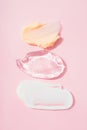 Set of cream and gel smears, various cosmetic products texture. Cream and gel smudges over pastel pink background Royalty Free Stock Photo