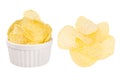 Set of crunchy golden rippled potato chips as heap and in ceramics bowl isolated on white background. Royalty Free Stock Photo